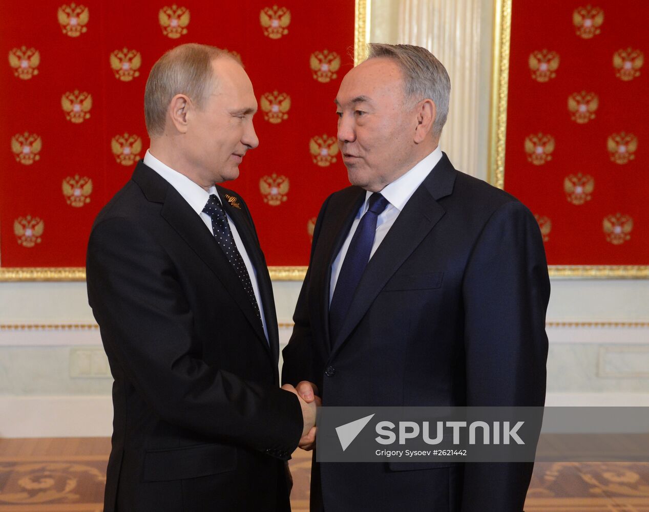 Russian President Vladimir Putin welcomes foreign delegation heads and honorary guests