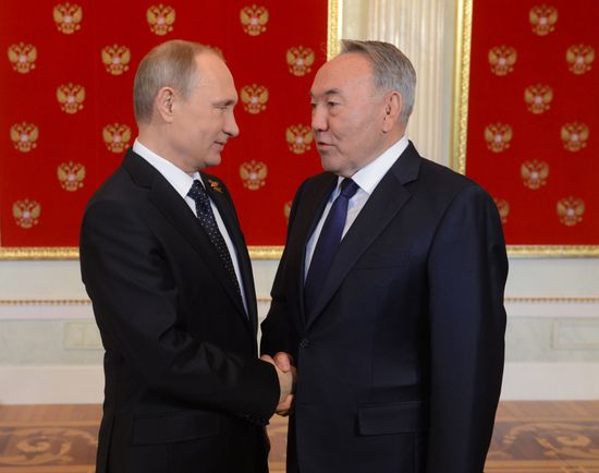 Russian President Vladimir Putin welcomes foreign delegation heads and honorary guests