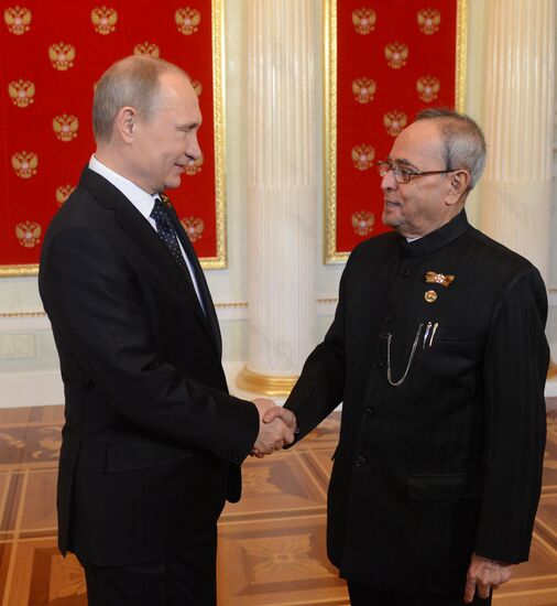 Russian President Vladimir Putin welcomes foreign delegation heads and honorary guests