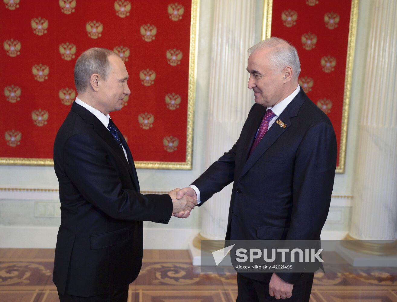 Russian President Vladimir Putin welcomes foreign delegation heads and honorary guests