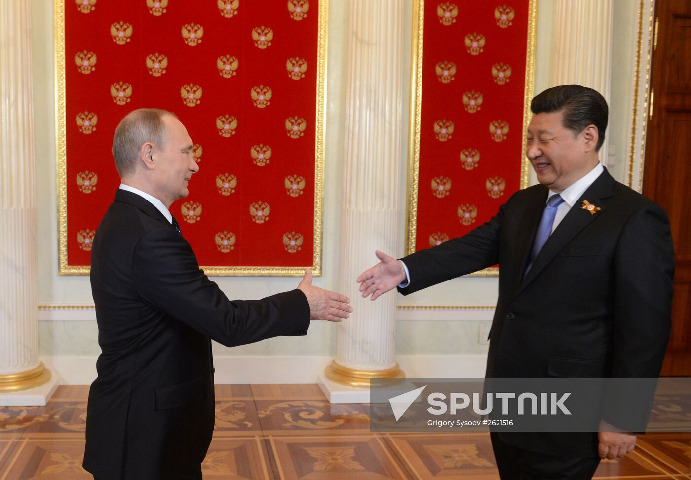 Russian President Vladimir Putin welcomes foreign delegation heads and honorary guests
