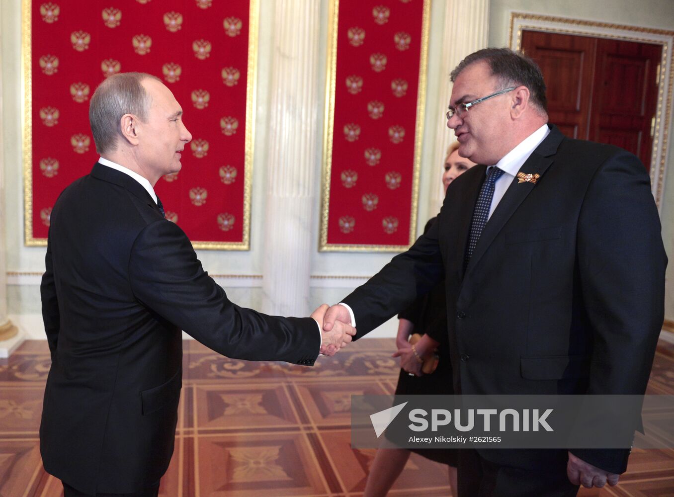 Russian President Vladimir Putin welcomes foreign delegation heads and honorary guests