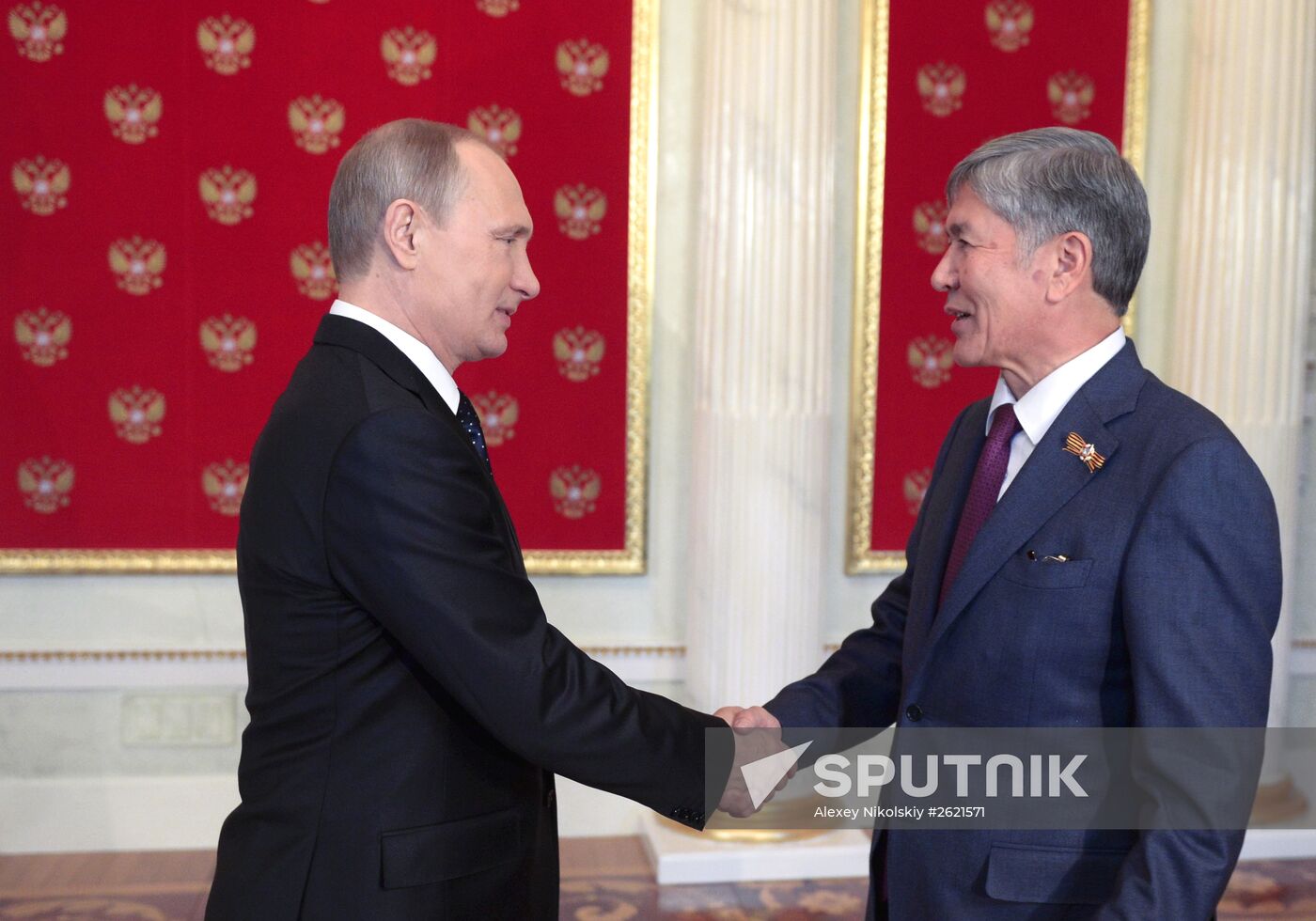 Russian President Vladimir Putin welcomes foreign delegation heads and honorary guests