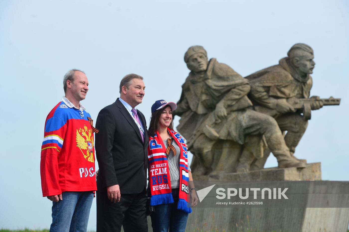 Members and coaches of Russian national ice hockey team lay flowers at National Memorial in Czech Republic
