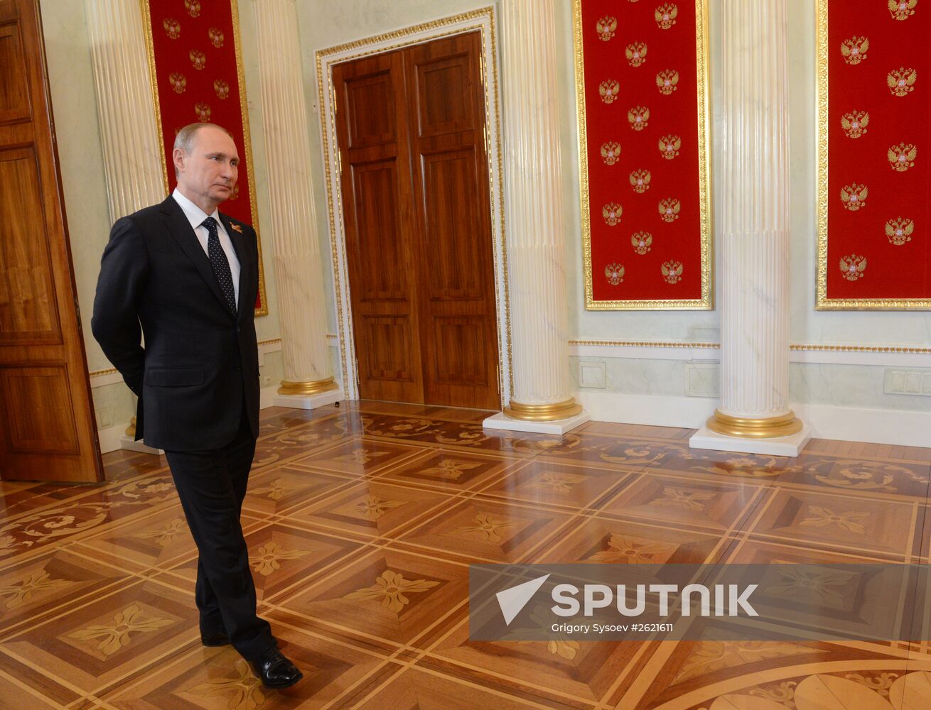 Russian President Vladimir Putin welcomes foreign delegation heads and honorary guests
