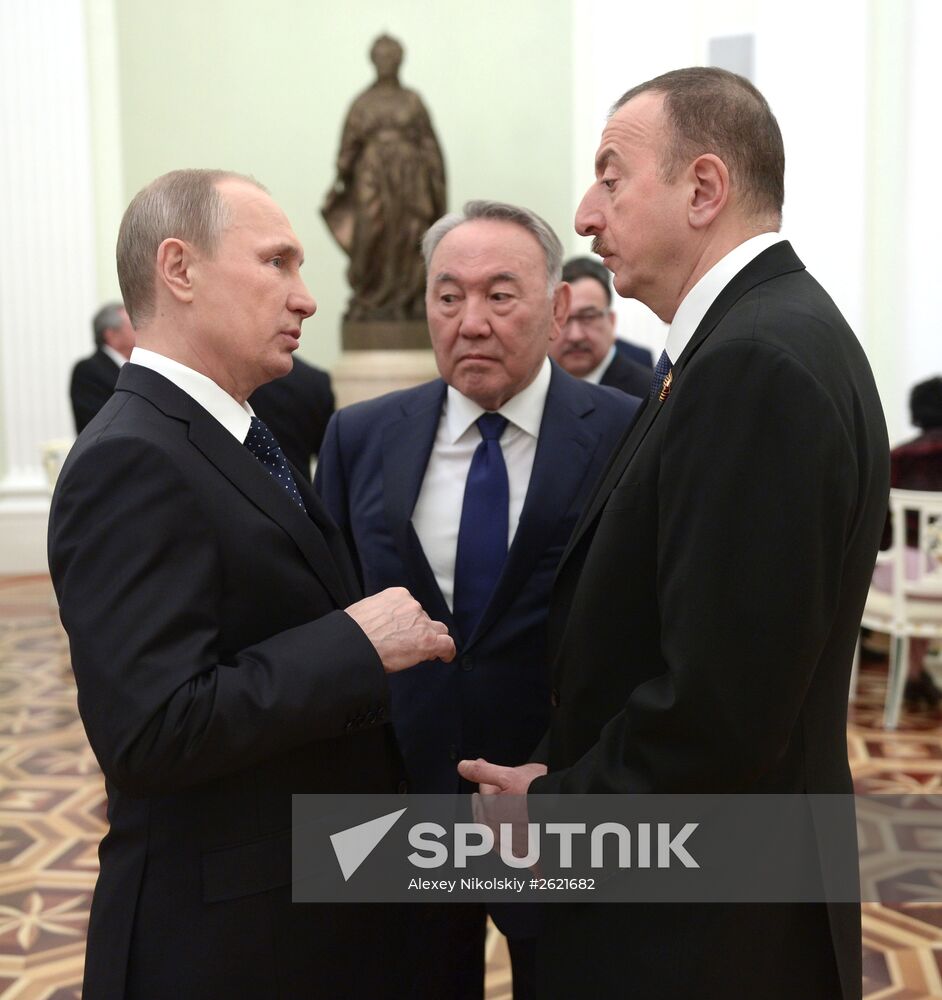 Russian President Vladimir Putin welcomes foreign delegation heads and honorary guests