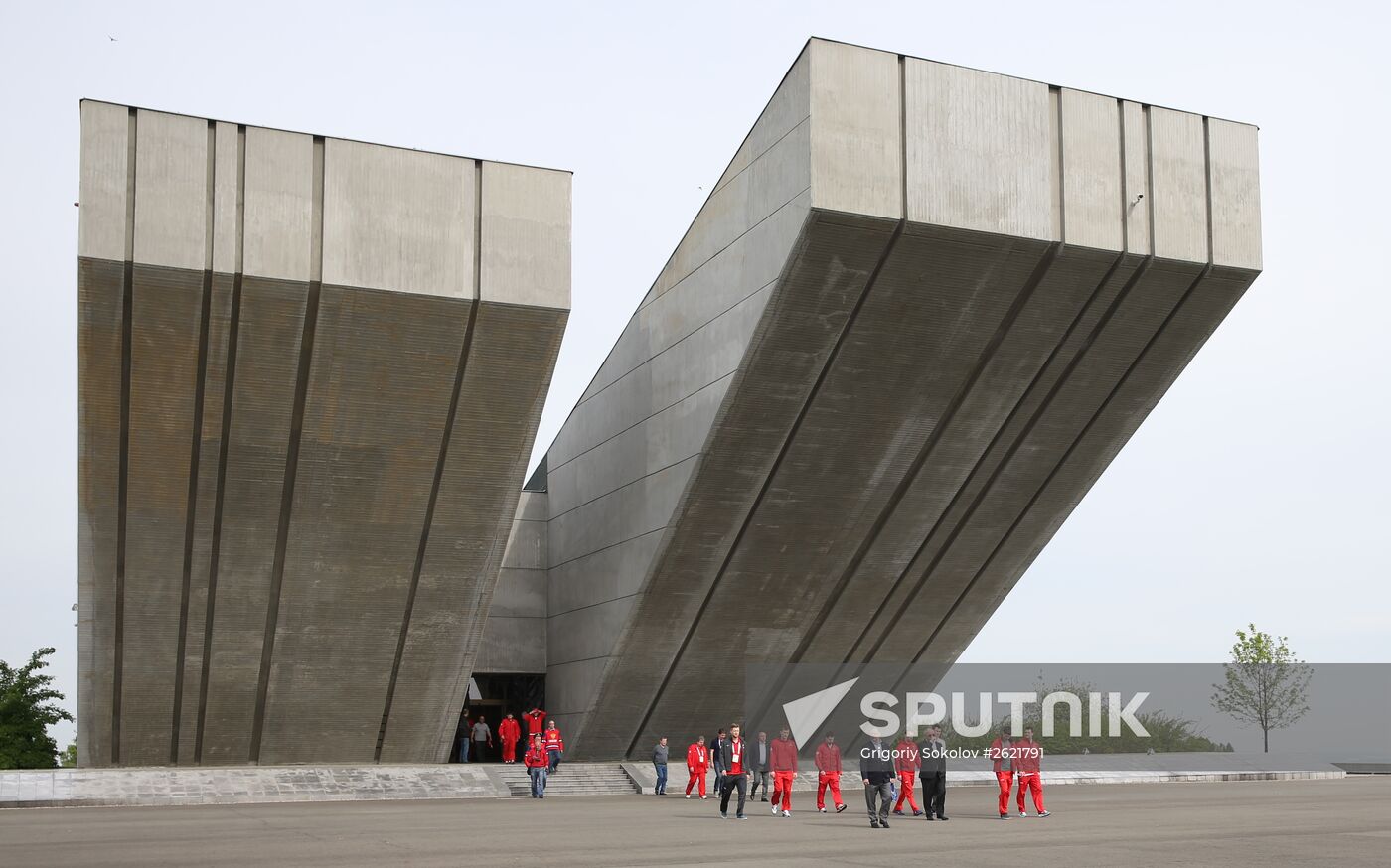 Members and coaches of Russian national ice hockey team lay flowers at National Memorial in Czech Republic