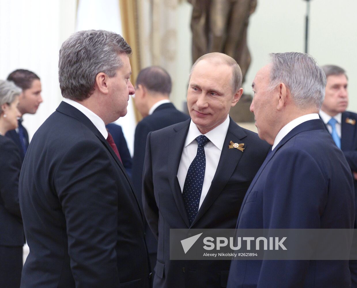 Russian President Vladimir Putin welcomes foreign delegation heads and honorary guests