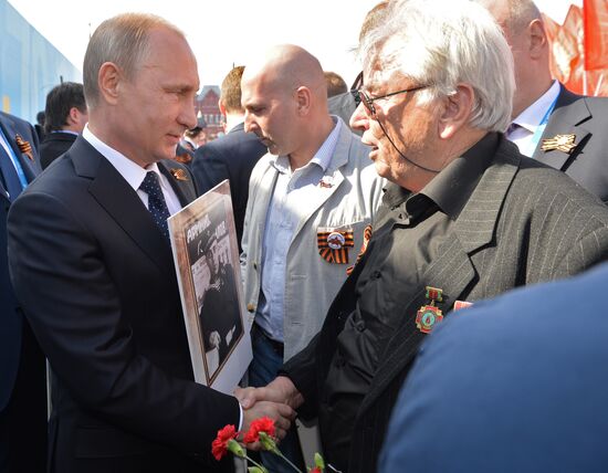 Russian President Vladimir Putin participates in march of Immortal Regiment in downtown Moscow