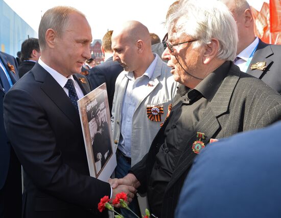 Russian President Vladimir Putin participates in march of Immortal Regiment in downtown Moscow