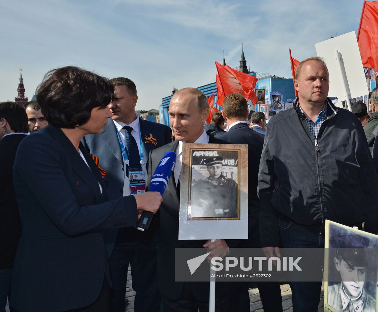 Russian President Vladimir Putin participates in march of Immortal Regiment in downtown Moscow
