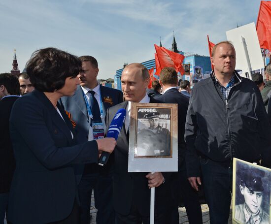 Russian President Vladimir Putin participates in march of Immortal Regiment in downtown Moscow