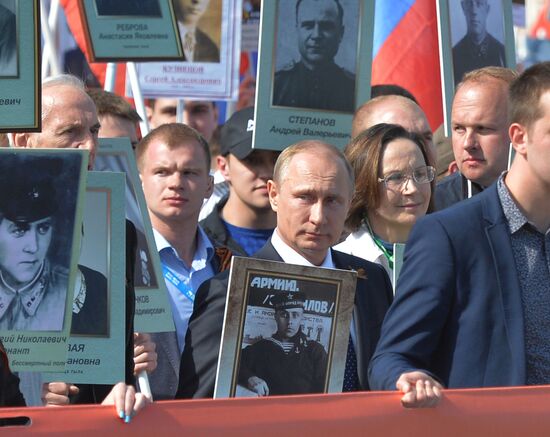 Russian President Vladimir Putin participates in march of Immortal Regiment in downtown Moscow