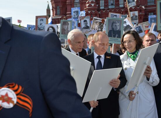 Russian President Vladimir Putin participates in march of Immortal Regiment in downtown Moscow