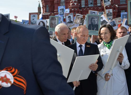 Russian President Vladimir Putin participates in march of Immortal Regiment in downtown Moscow