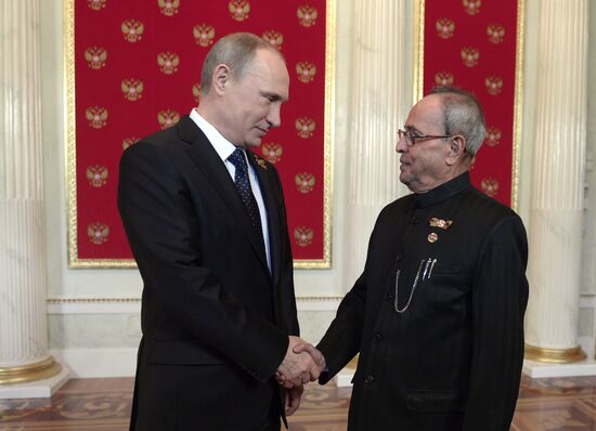 Russian President Vladimir Putin welcomes foreign delegation heads and honorary guests