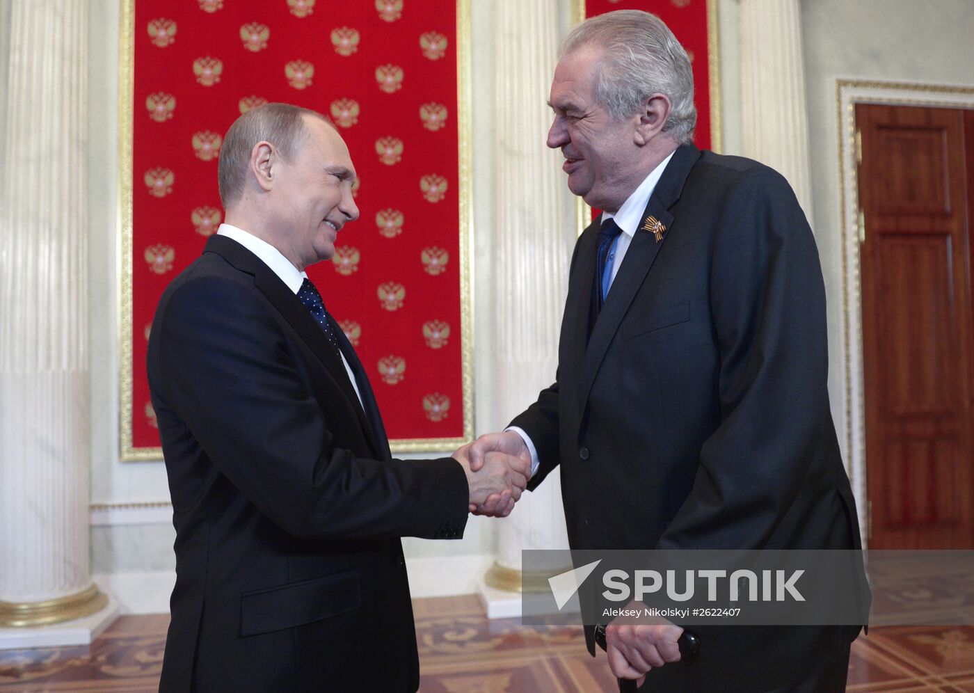 Russian President Vladimir Putin welcomes foreign delegation heads and honorary guests