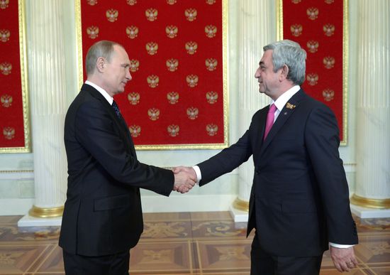 Russian President Vladimir Putin welcomes foreign delegation heads and honorary guests