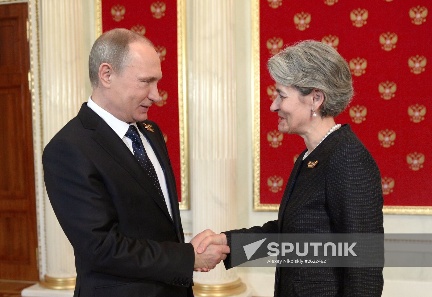 Russian President Vladimir Putin welcomes foreign delegation heads and honorary guests