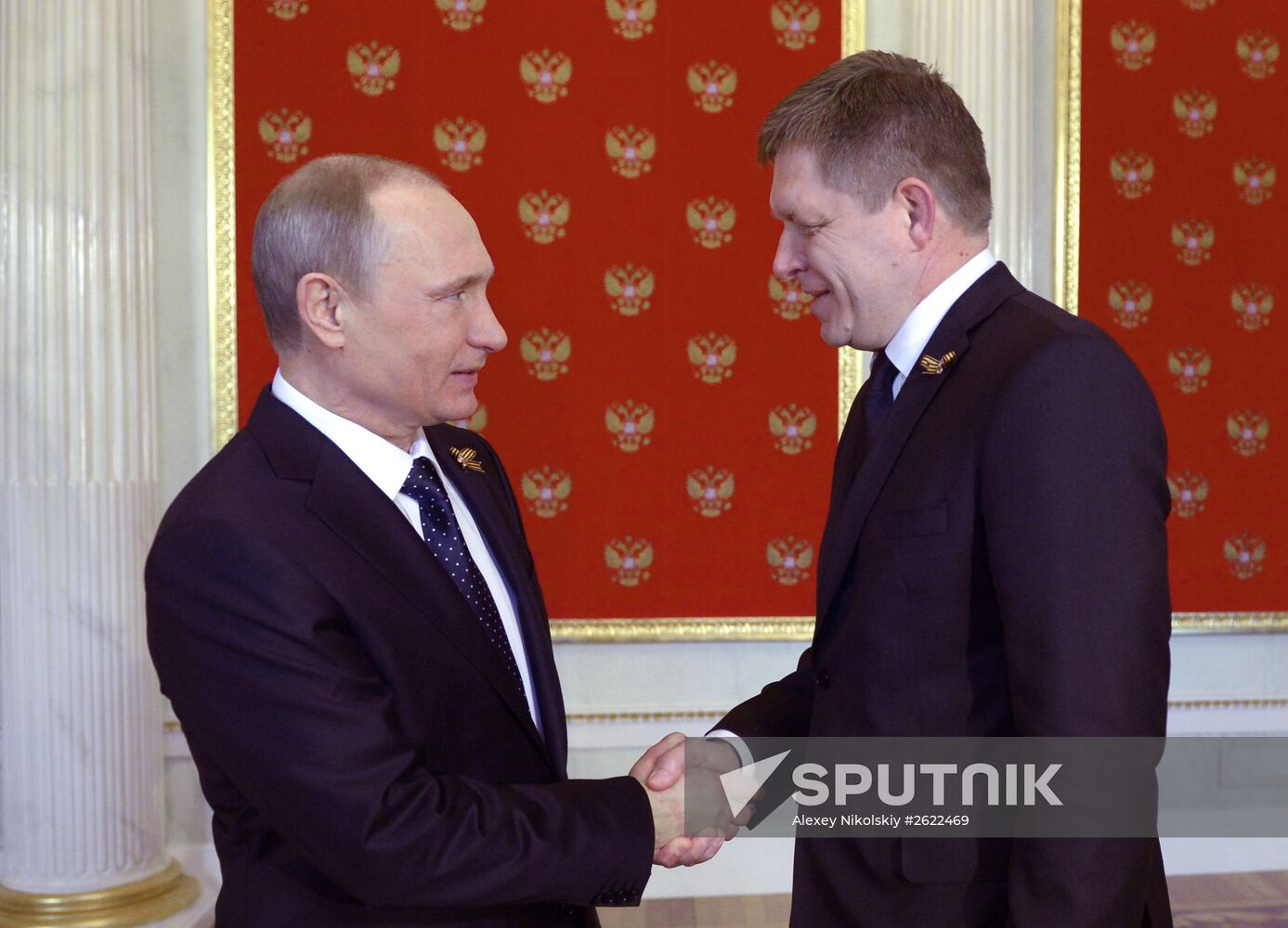 Russian President Vladimir Putin welcomes foreign delegation heads and honorary guests