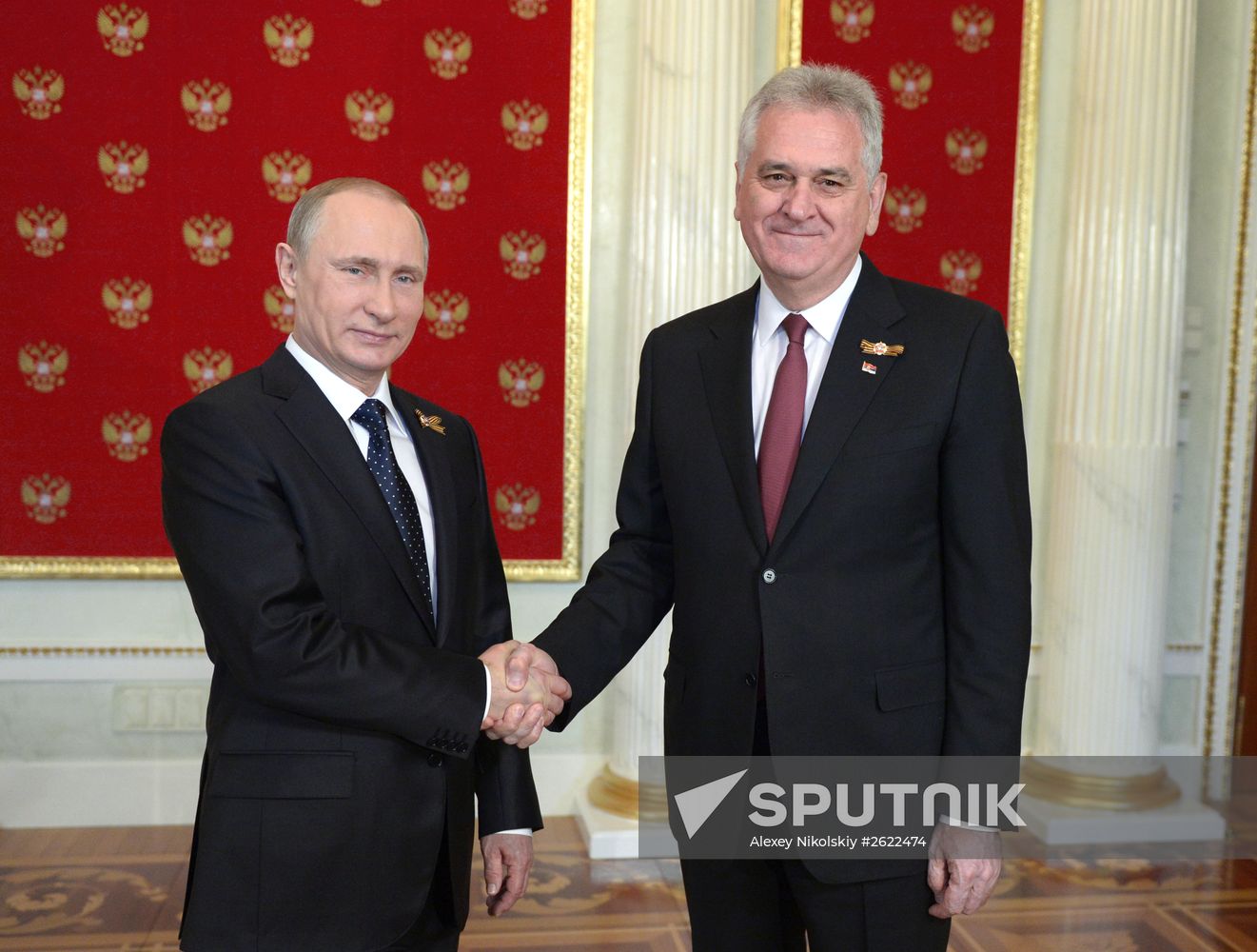 Russian President Vladimir Putin welcomes foreign delegation heads and honorary guests