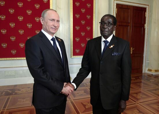 Russian President Vladimir Putin welcomes foreign delegation heads and honorary guests