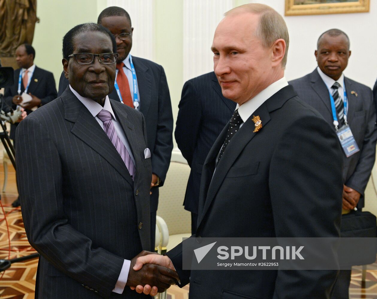 Russian President Vladimir Putin meets with President of Zimbabwe Robert Mugabe