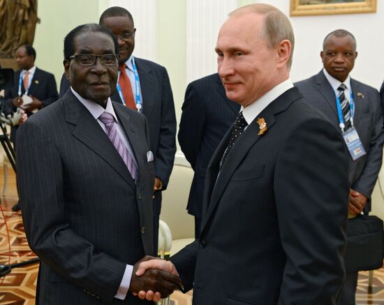 Russian President Vladimir Putin meets with President of Zimbabwe Robert Mugabe