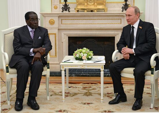 Russian President Vladimir Putin meets with President of Zimbabwe Robert Mugabe