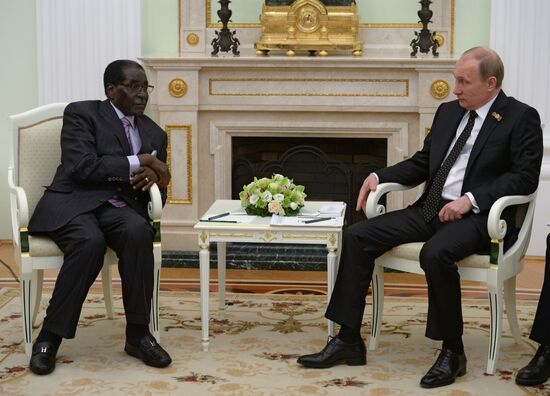 Russian President Vladimir Putin meets with President of Zimbabwe Robert Mugabe