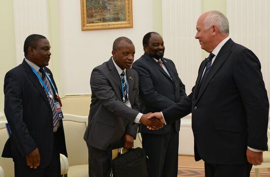 Russian President Vladimir Putin meets with President of Zimbabwe Robert Mugabe