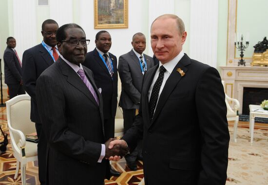 Russian President Vladimir Putin meets with President of Zimbabwe Robert Mugabe