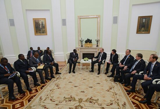 Russian President Vladimir Putin meets with President of Zimbabwe Robert Mugabe