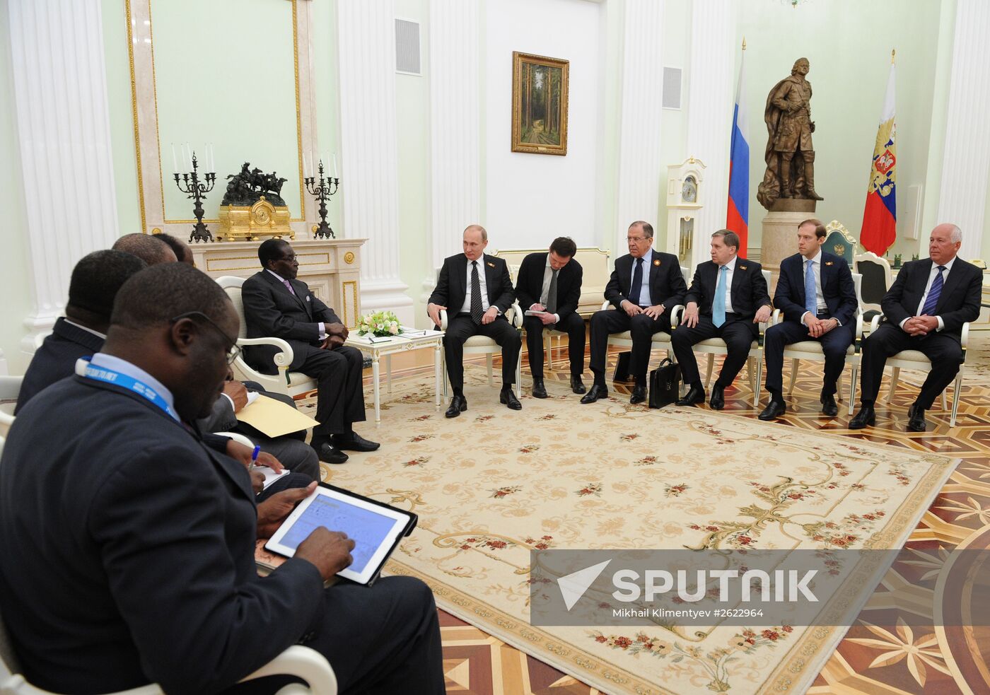 Russian President Vladimir Putin meets with President of Zimbabwe Robert Mugabe