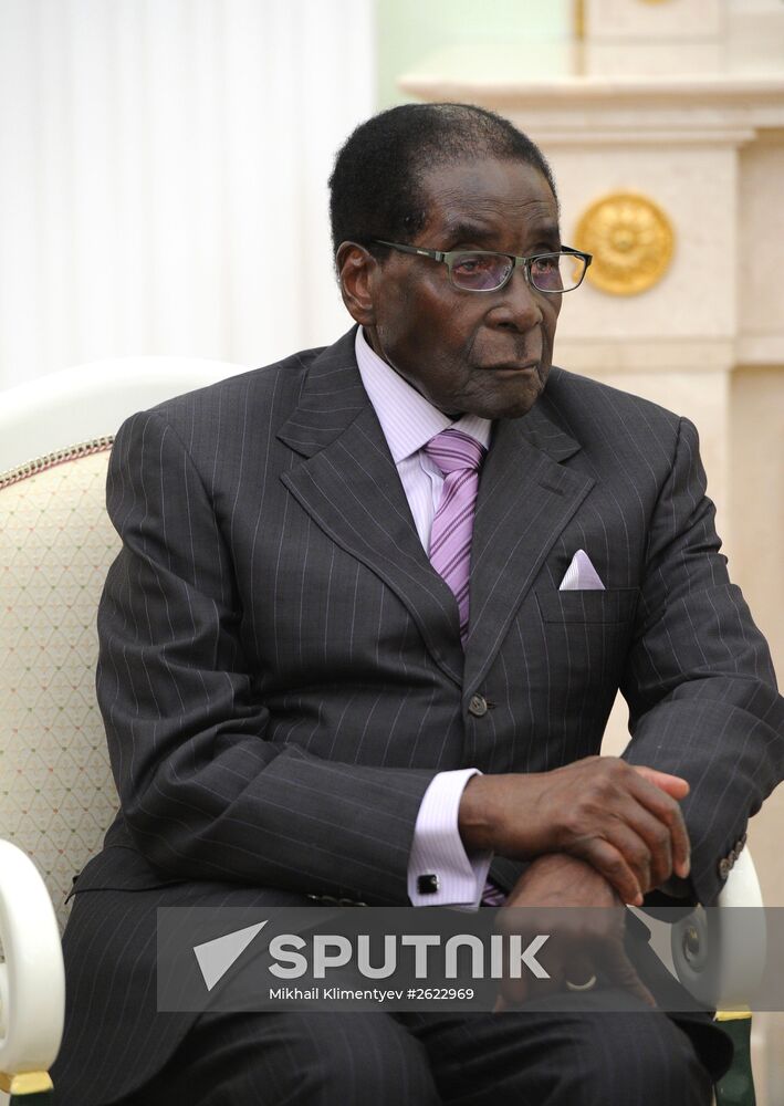 Russian President Vladimir Putin meets with President of Zimbabwe Robert Mugabe