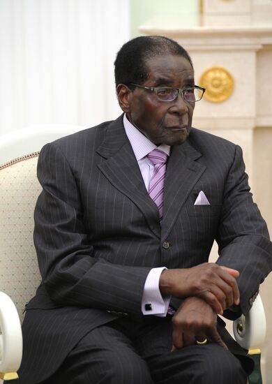 Russian President Vladimir Putin meets with President of Zimbabwe Robert Mugabe