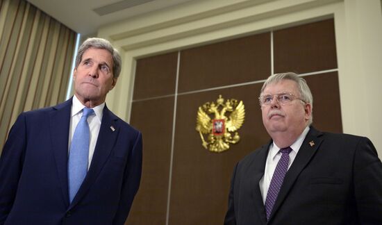 Russian President Vladimir Putin meets with US Secretary of State John Kerry