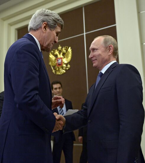 Russian President Vladimir Putin meets with US Secretary of State John Kerry