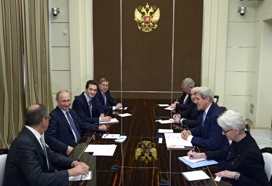 Russian President Vladimir Putin meets with US Secretary of State John Kerry