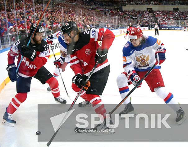 From left: Canadian players Ryan O'Reilly and Claude Giroux and Russian player Viktor Tikhonov during the final match of the 2015 IIHF World Championship, Canada vs. Russia. Location: Czech Republic, Prague. Author: Grigoriy Sokolov/Sputnik. 2015 IIHF World Championship. Finals. Canada vs. Russia