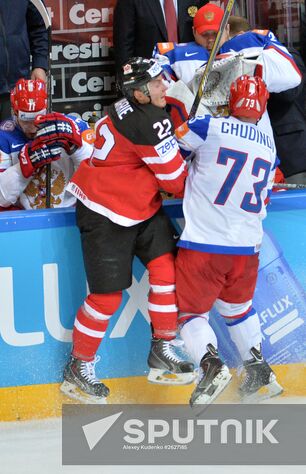 Canadian player Tyson Barrie, left, and Russia's Maxim Chudinov during the final match of the 2015 IIHF World Championship, Canada vs. Russia. Location: Czech Republic, Prague. Author: Alexey Kudenko/Sputnik. 2015 IIHF World Championship. Finals. Canada vs. Russia