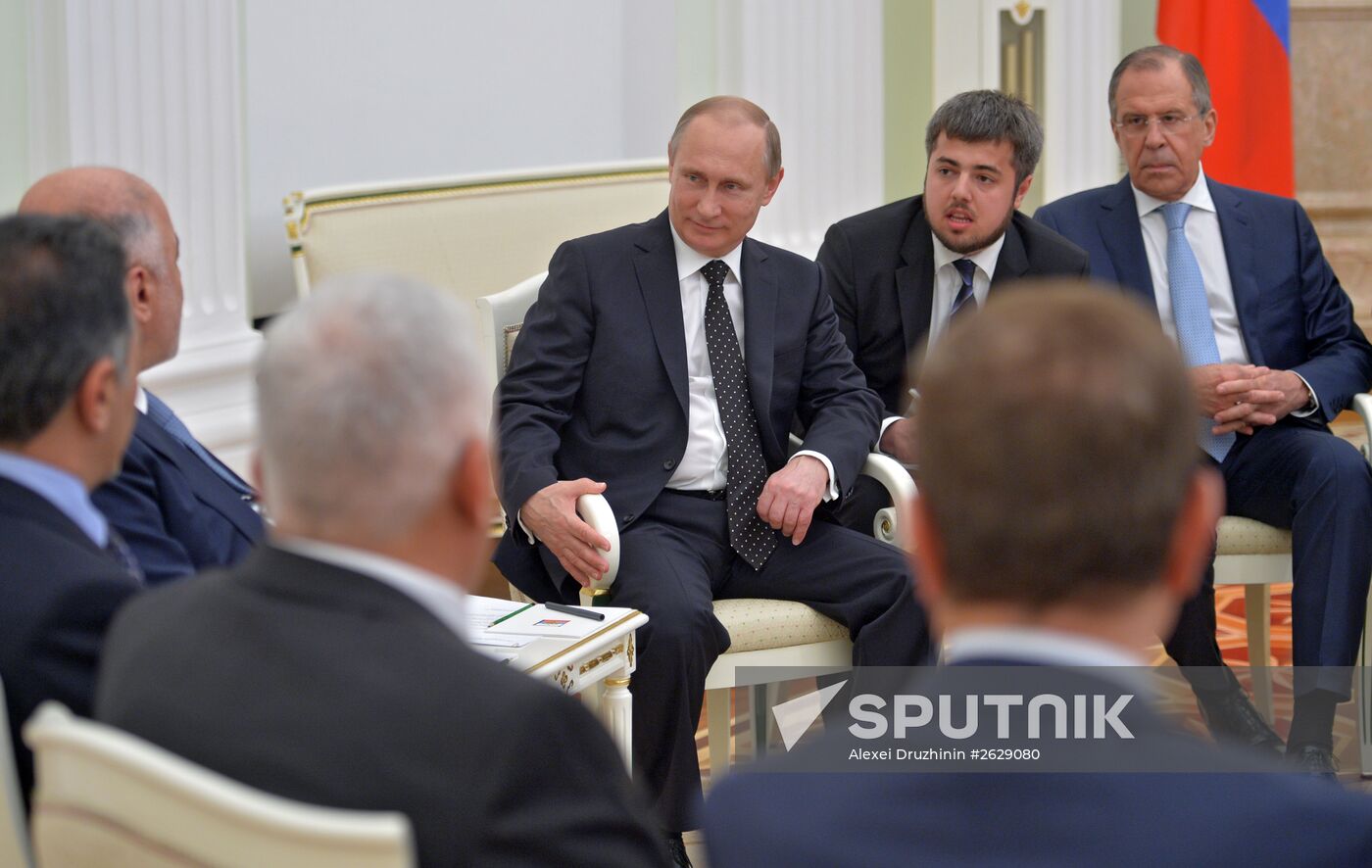 Russian President Vladimir Putin meets with Iraqi Prime Minister Haider Al-Abadi