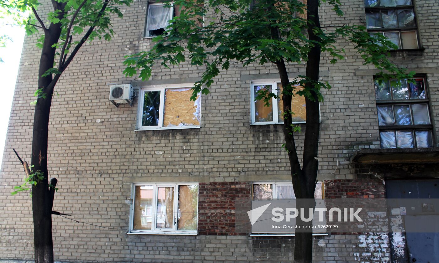 Broken windows in attacked residential buildings in Donetsk