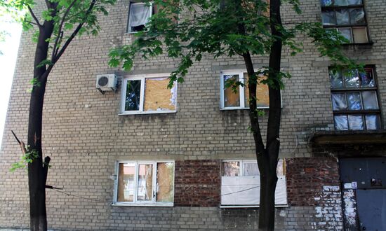 Broken windows in attacked residential buildings in Donetsk