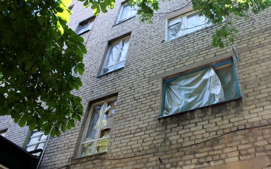 Broken windows in attacked residential buildings in Donetsk