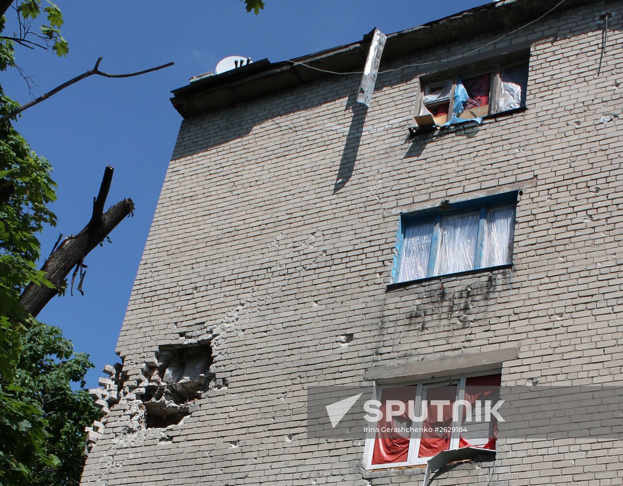 Broken windows in attacked residential buildings in Donetsk