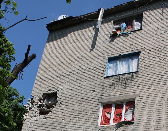 Broken windows in attacked residential buildings in Donetsk