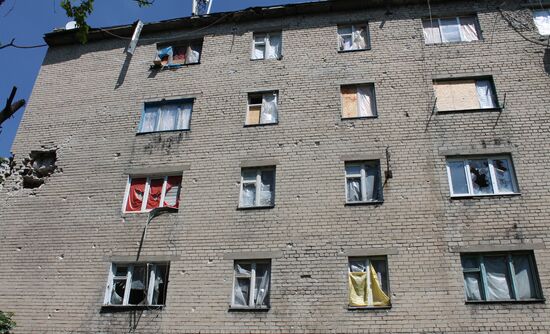 Broken windows in attacked residential buildings in Donetsk