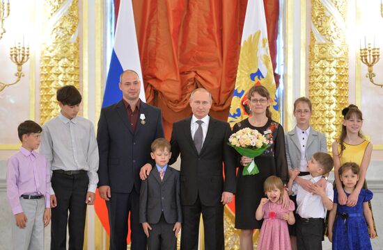 Russian President V.Putin presents Orders of Parental Glory to parents of large families
