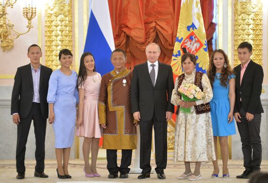 Russian President V.Putin presents Orders of Parental Glory to parents of large families